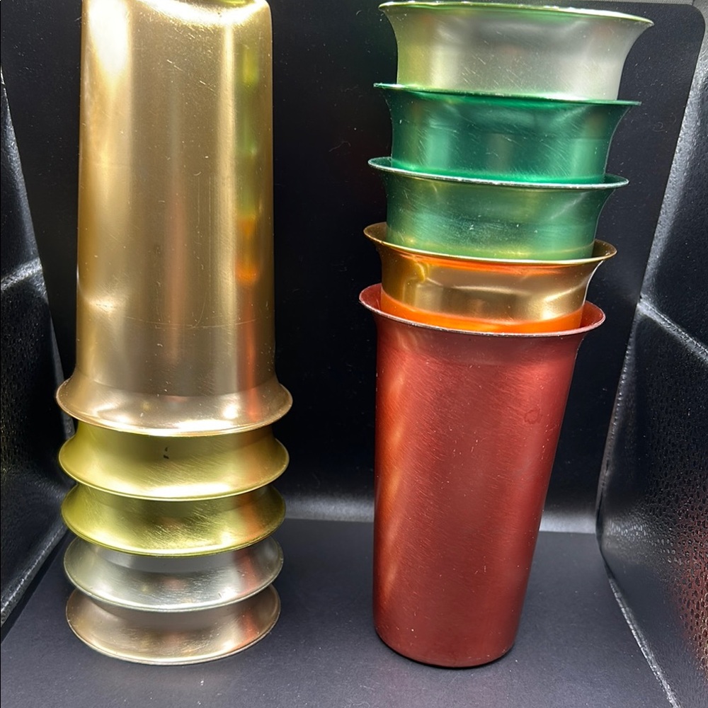 Set of 10 aluminum tumblers. Great vintage condition.